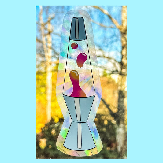 Lava Lamp Suncatcher on window casting vibrant rainbow light