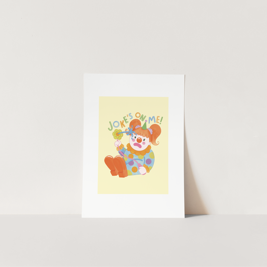 Colorful greeting card with a clown illustration and 'Jokes on me!' text on a white background.